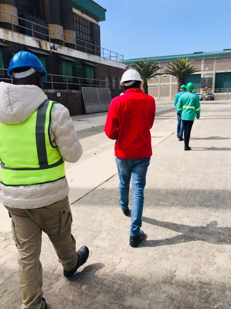 A team walking through an operational facility area